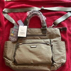 New with tags Baggallini grey 3 in 1 backpack.